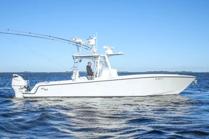  Yacht Photos Pics 2012 SeaVee 340B boat cruising on open water under clear blue sky.