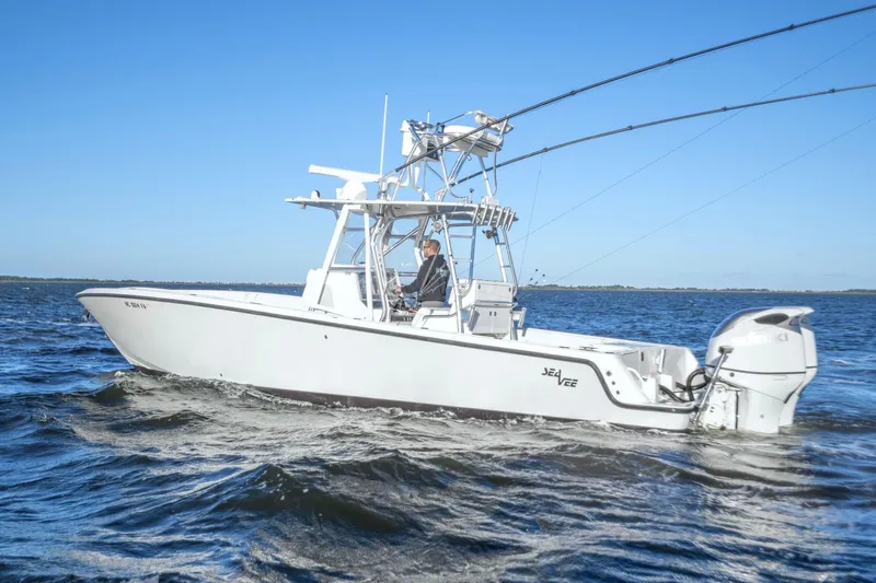  Yacht Photos Pics 2012 SeaVee 340B boat cruising on open water under clear blue skies.