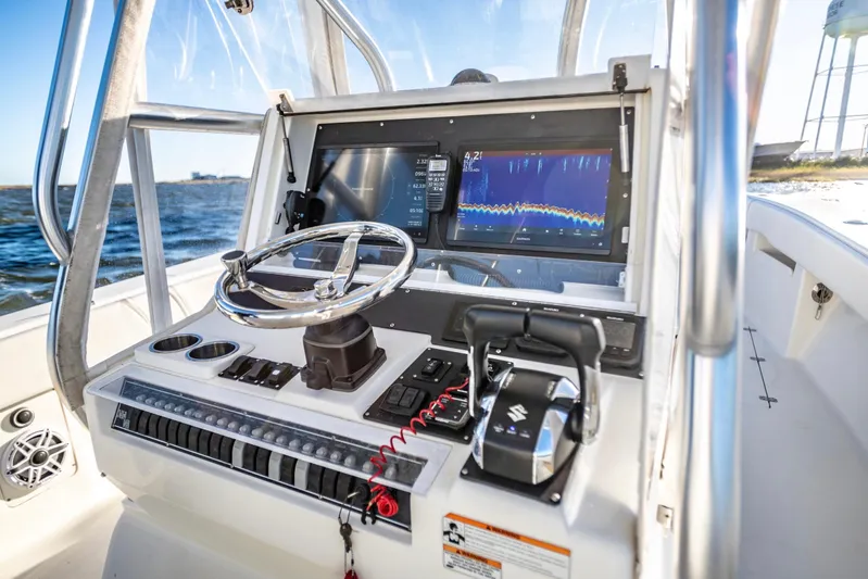  Yacht Photos Pics 2012 SeaVee 340B boat dashboard with steering wheel and navigation display.