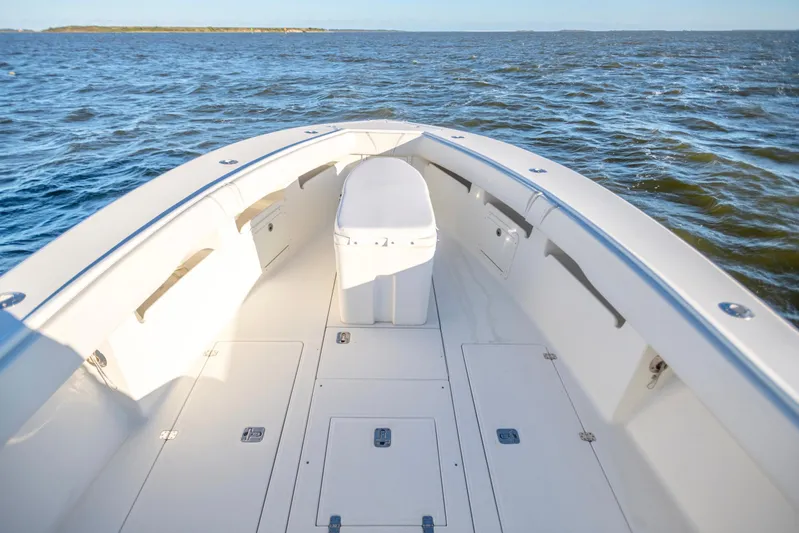  Yacht Photos Pics 2012 SeaVee 340B boat deck with ocean view, showcasing spacious design and storage compartments.