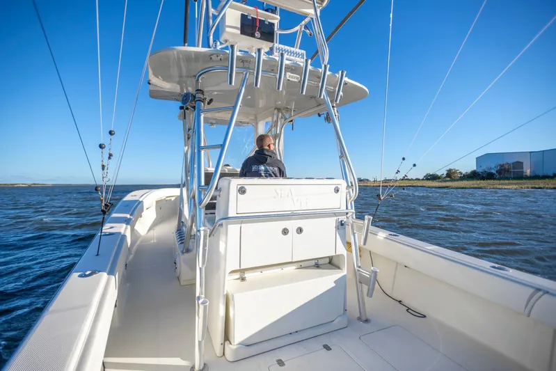  Yacht Photos Pics 2012 SeaVee 340B boat cruising on open water under clear blue sky.