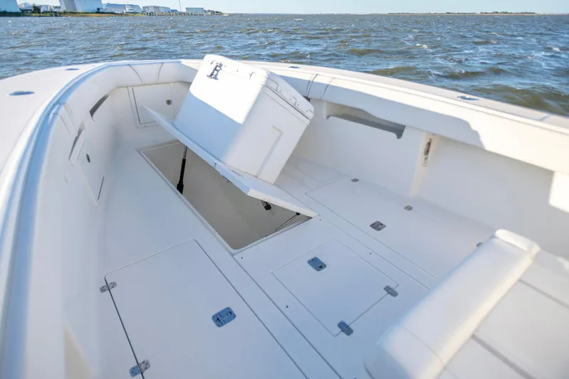  Yacht Photos Pics 2012 SeaVee 340B boat deck with open storage compartments on the water.