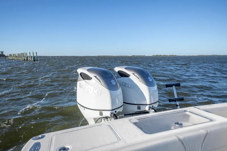  Yacht Photos Pics Twin Suzuki outboard engines on a 2012 SeaVee 340B boat in open water.