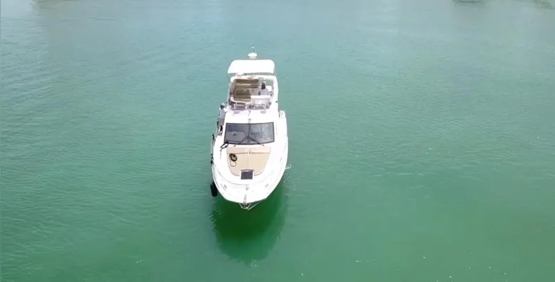 Dreamer Yacht Photos Pics Azimut 40 Flybridge 2013 yacht on calm green water, aerial view.