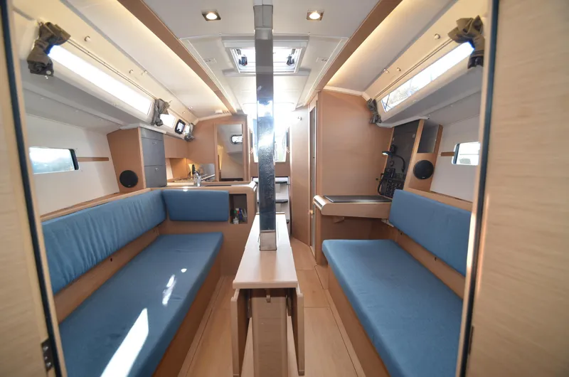 Sea To Summit Yacht Photos Pics Interior of 2022 Jeanneau Sun Odyssey 349 sailboat with blue seating and modern design.
