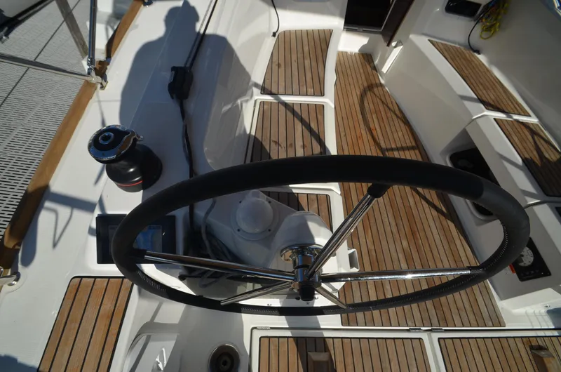Sea To Summit Yacht Photos Pics 2022 Jeanneau Sun Odyssey 349 cockpit with steering wheel and teak flooring.