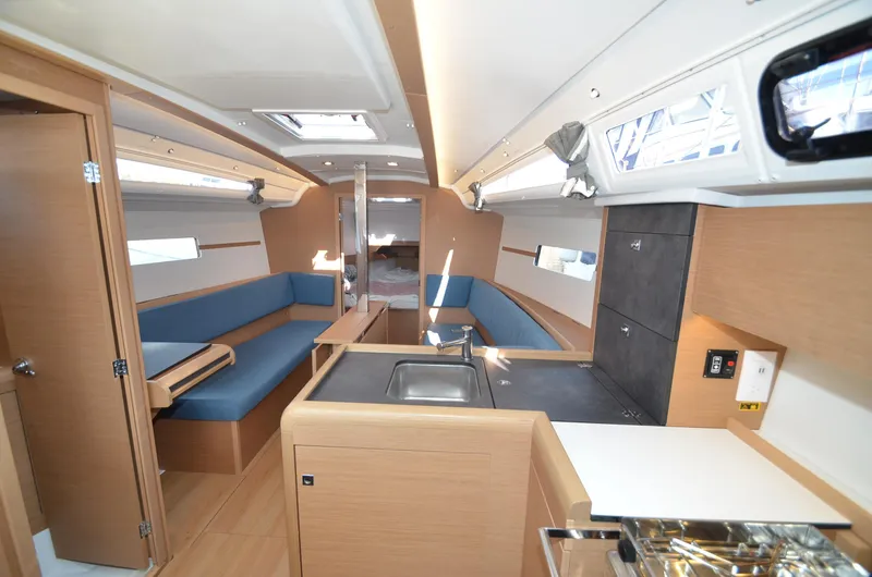 Sea To Summit Yacht Photos Pics Interior of 2022 Jeanneau Sun Odyssey 349 sailboat with modern design and blue seating.