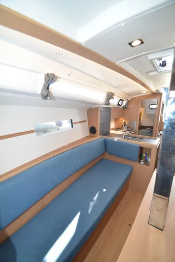 Sea To Summit Yacht Photos Pics Interior of 2022 Jeanneau Sun Odyssey 349 sailboat with blue seating and modern design.