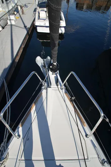 Sea To Summit Yacht Photos Pics 2022 Jeanneau Sun Odyssey 349 sailboat bow at marina dock.