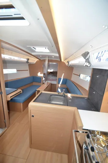Sea To Summit Yacht Photos Pics Interior of 2022 Jeanneau Sun Odyssey 349 sailboat with modern design and blue seating.