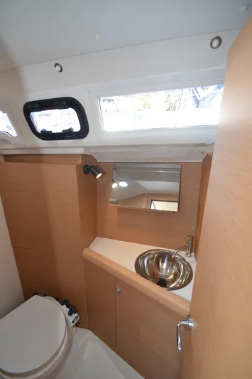 Sea To Summit Yacht Photos Pics 2022 Jeanneau Sun Odyssey 349 bathroom with modern fixtures and natural light.