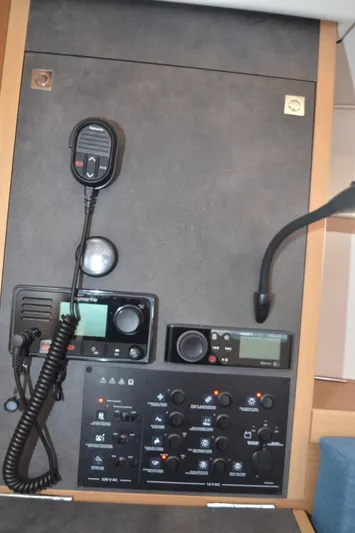 Sea To Summit Yacht Photos Pics Control panel of 2022 Jeanneau Sun Odyssey 349 sailboat with communication equipment.