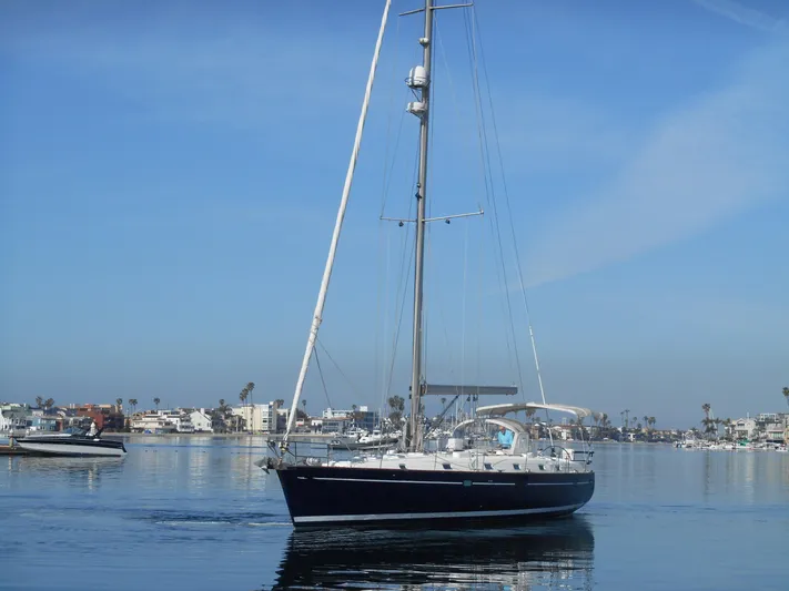 Eventus Yacht Photos Pics Beneteau Oceanis 50 sailboat from 2000 on calm water, clear blue sky.