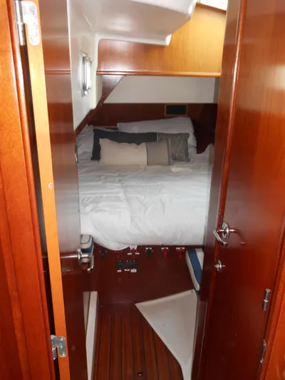 Eventus Yacht Photos Pics Cozy cabin interior of 2000 Beneteau Oceanis 50 sailboat with wooden finish.
