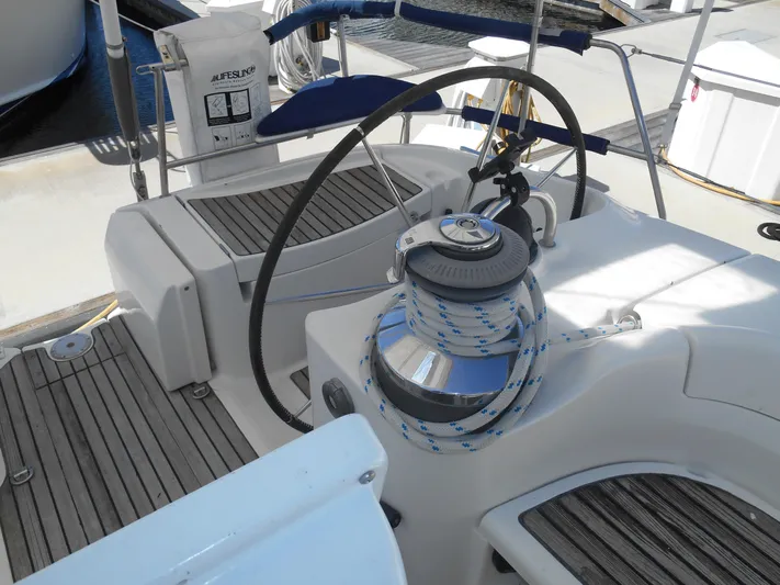 Eventus Yacht Photos Pics Cockpit of 2000 Beneteau Oceanis 50 sailboat with steering wheel and winch.