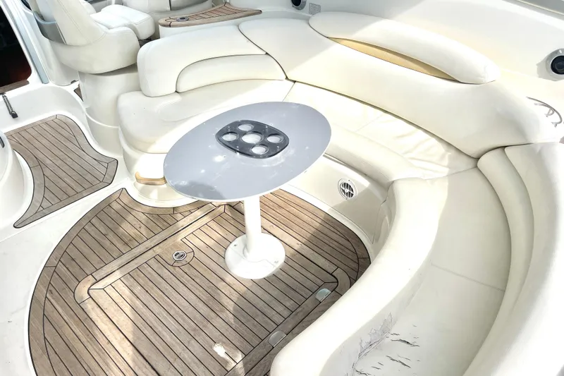 Saphir Bleu Yacht Photos Pics Luxurious 2006 Cranchi Mediterranee 50 HT yacht interior with elegant seating and wooden flooring.