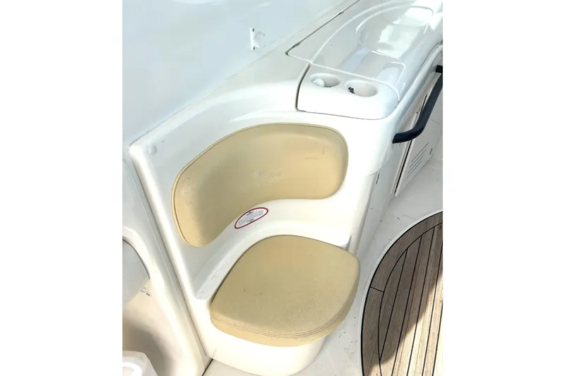 Saphir Bleu Yacht Photos Pics Cream seat on 2006 Cranchi Mediterranee 50 HT yacht with wooden deck detail.