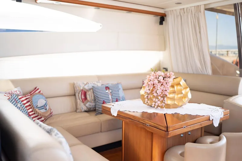  Yacht Photos Pics Luxurious interior of 2007 Sunseeker Predator 72 yacht with elegant seating and decorative pillows.