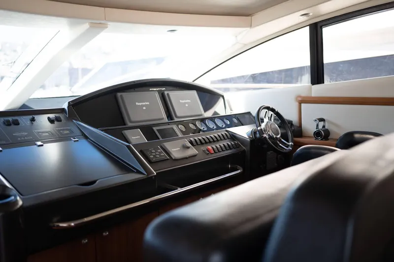  Yacht Photos Pics Interior helm of 2007 Sunseeker Predator 72 yacht, featuring modern navigation equipment.