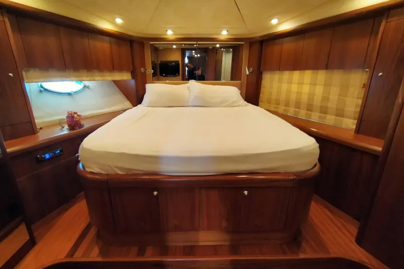  Yacht Photos Pics Luxurious cabin interior of 2007 Sunseeker Predator 72 yacht with elegant wood finish.