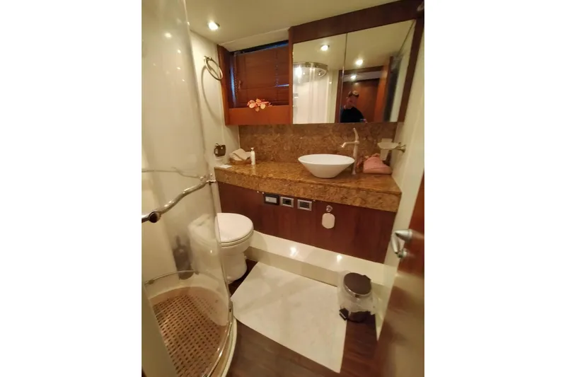  Yacht Photos Pics Luxurious bathroom in 2007 Sunseeker Predator 72 yacht with modern fixtures and elegant design.