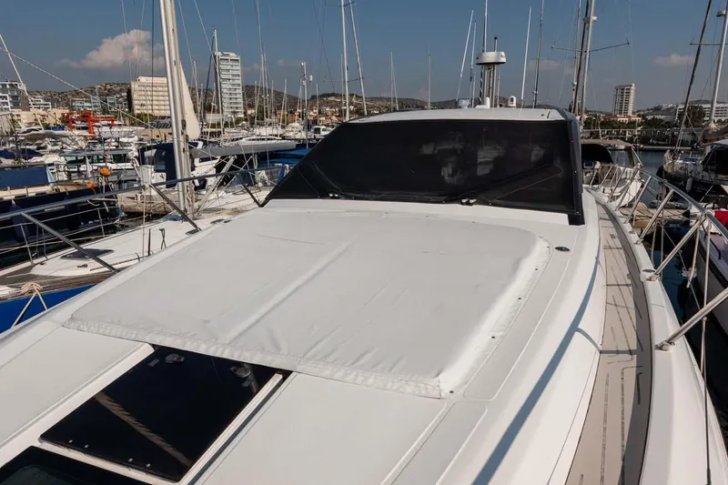  Yacht Photos Pics 2018 Azimut Atlantis 51 yacht docked in a marina, surrounded by other boats.