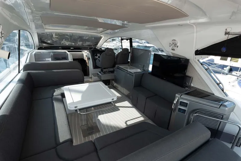  Yacht Photos Pics Luxurious interior of 2018 Azimut Atlantis 51 yacht with modern seating and entertainment area.