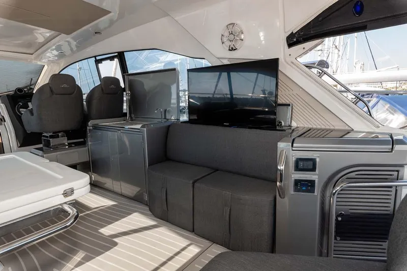  Yacht Photos Pics Luxurious interior of 2018 Azimut Atlantis 51 yacht with modern seating and entertainment system.