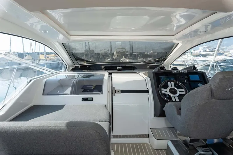  Yacht Photos Pics 2018 Azimut Atlantis 51 yacht cockpit with modern steering and navigation controls.