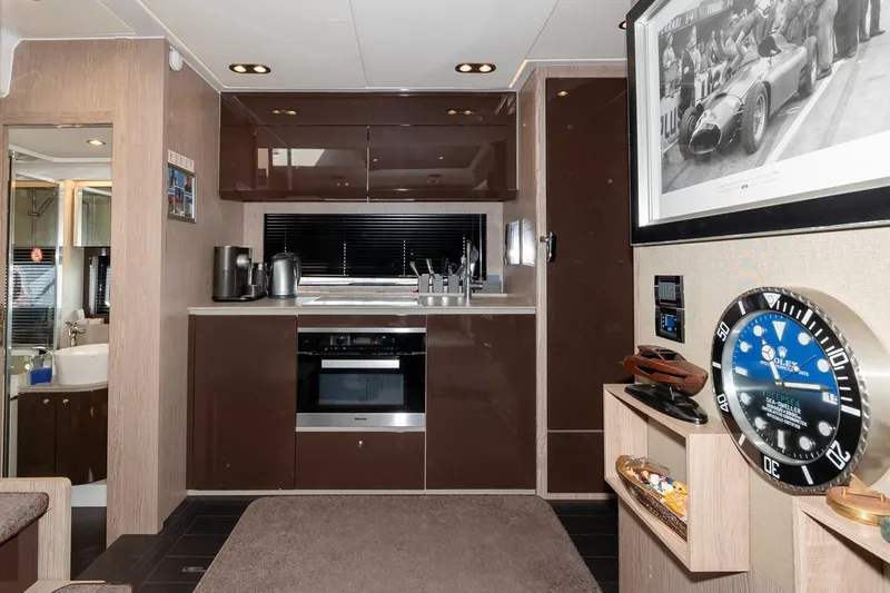  Yacht Photos Pics Luxurious kitchen interior of 2018 Azimut Atlantis 51 yacht with modern appliances and decor.