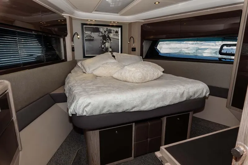  Yacht Photos Pics Luxurious bedroom interior of 2018 Azimut Atlantis 51 yacht with elegant bedding and modern decor.