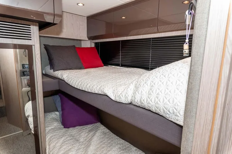  Yacht Photos Pics Luxurious cabin interior of 2018 Azimut Atlantis 51 yacht with cozy bunk beds.