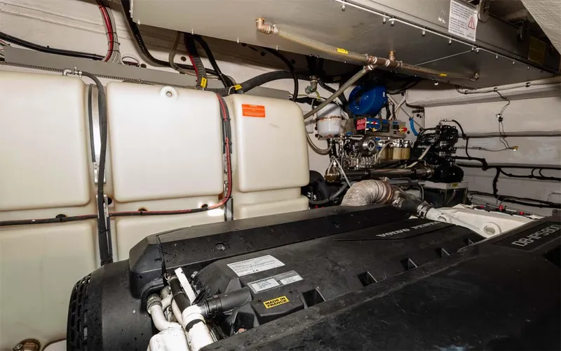  Yacht Photos Pics Engine room of 2018 Azimut Atlantis 51 yacht, showcasing mechanical components and storage tanks.