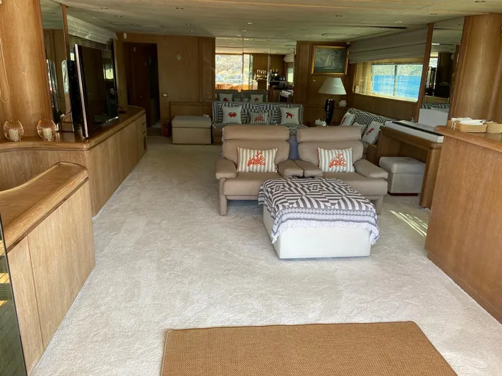  Yacht Photos Pics Luxurious interior of 1992 Cantieri di Pisa Akhir 30S yacht, featuring elegant seating and decor.