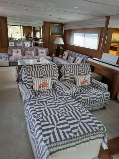  Yacht Photos Pics Luxurious interior of 1992 Cantieri di Pisa Akhir 30S yacht with patterned seating and elegant decor.