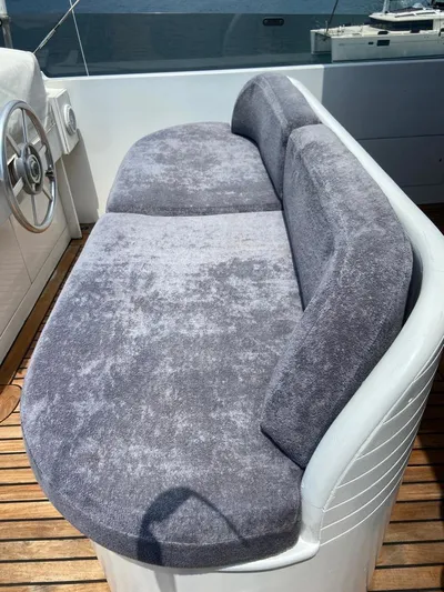  Yacht Photos Pics Luxurious seating on 1992 Cantieri di Pisa Akhir 30S yacht, featuring plush gray upholstery.
