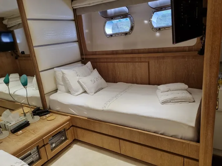  Yacht Photos Pics Luxurious cabin interior of 1992 Cantieri di Pisa Akhir 30S yacht with elegant bedding.