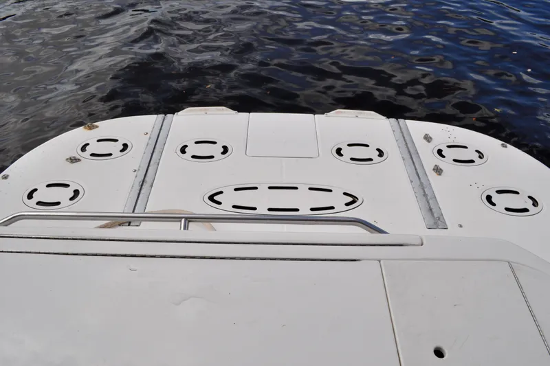 King Leisure Yacht Photos Pics 2002 Sea Ray 480 Sedan Bridge swim platform with water backdrop.