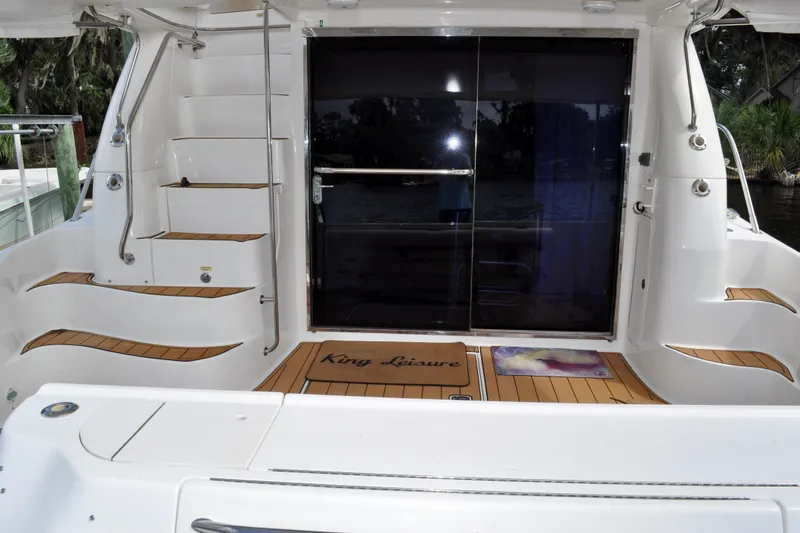 King Leisure Yacht Photos Pics 2002 Sea Ray 480 Sedan Bridge yacht with teak deck and sliding glass doors.