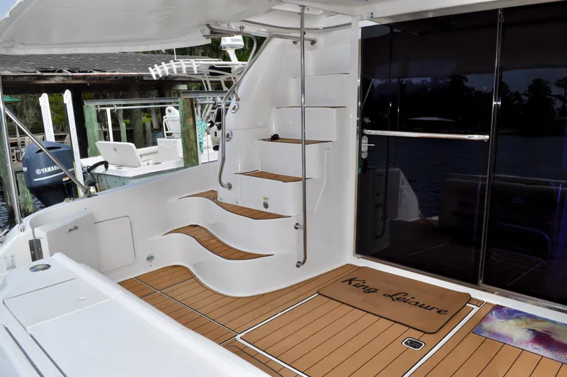 King Leisure Yacht Photos Pics 2002 Sea Ray 480 Sedan Bridge yacht with teak deck and elegant interior stairs.