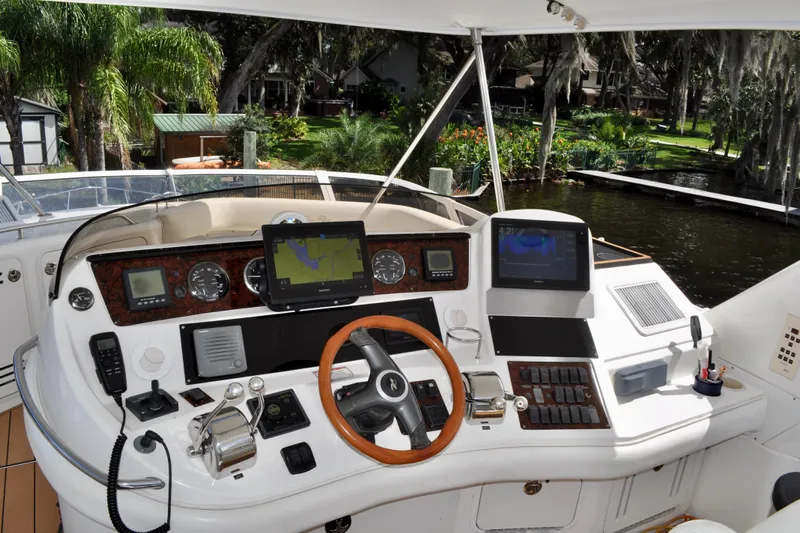 King Leisure Yacht Photos Pics Cockpit of 2002 Sea Ray 480 Sedan Bridge with navigation equipment and controls.