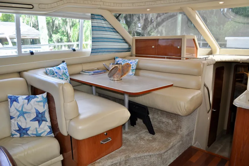 King Leisure Yacht Photos Pics Luxurious 2002 Sea Ray 480 Sedan Bridge interior with plush seating and nautical decor.