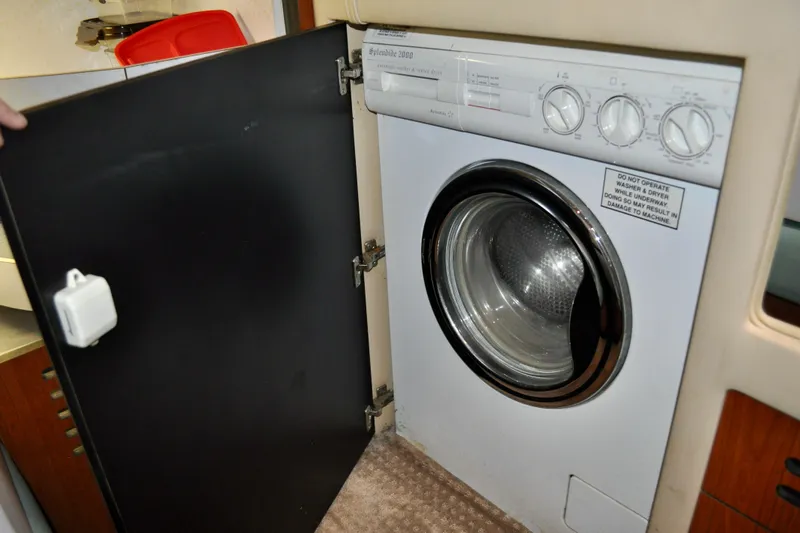King Leisure Yacht Photos Pics Washer-dryer unit inside 2002 Sea Ray 480 Sedan Bridge yacht.