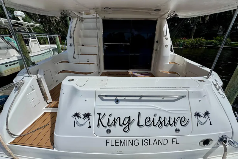 King Leisure Yacht Photos Pics 2002 Sea Ray 480 Sedan Bridge yacht docked, featuring "King Leisure" name, Fleming Island, FL.
