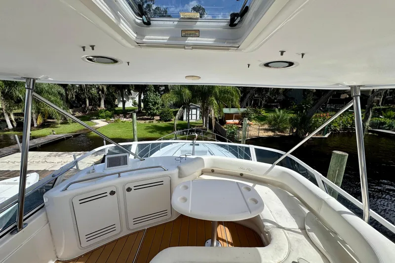 King Leisure Yacht Photos Pics 2002 Sea Ray 480 Sedan Bridge yacht interior with scenic waterfront view.