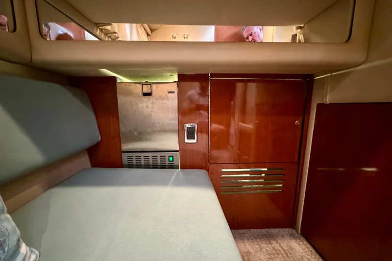 King Leisure Yacht Photos Pics Interior cabin of 2002 Sea Ray 480 Sedan Bridge with wood paneling and seating.