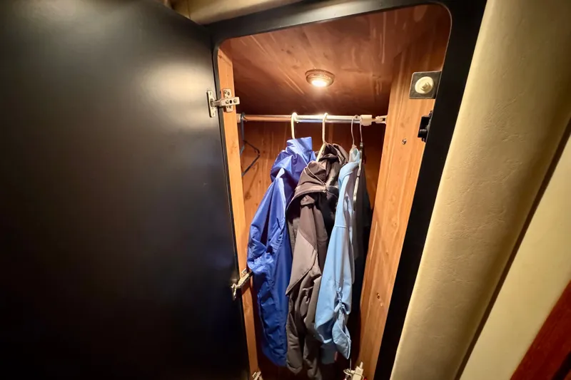 King Leisure Yacht Photos Pics Closet interior with jackets on hangers in 2002 Sea Ray 480 Sedan Bridge.