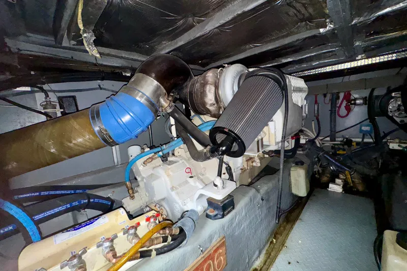 King Leisure Yacht Photos Pics Engine room of a 2002 Sea Ray 480 Sedan Bridge yacht, showcasing mechanical components.