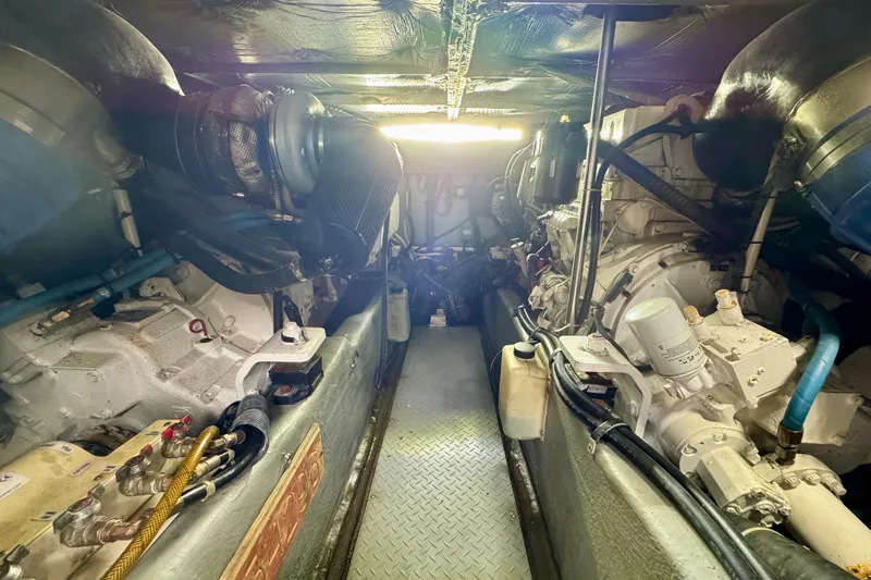 King Leisure Yacht Photos Pics Engine room of a 2002 Sea Ray 480 Sedan Bridge yacht, showcasing dual engines.