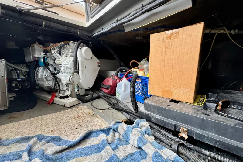 King Leisure Yacht Photos Pics Engine room of 2002 Sea Ray 480 Sedan Bridge with equipment and storage items.